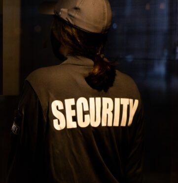 man in black and white hoodie wearing brown helmet